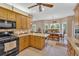 Open kitchen featuring a breakfast bar, stainless steel appliances, and a dining area with lots of natural light at 17 Sassafras Ne Trl, Cartersville, GA 30121