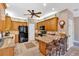 Well-appointed kitchen with wood cabinets, granite countertops, and modern black appliances at 17 Sassafras Ne Trl, Cartersville, GA 30121