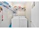 This efficient laundry room includes a washer, dryer, and storage for laundry supplies at 17 Sassafras Ne Trl, Cartersville, GA 30121