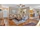 Open-concept living room with hardwood floors, a comfortable sectional, and views into the kitchen at 17 Sassafras Ne Trl, Cartersville, GA 30121