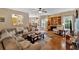 Inviting living room featuring hardwood floors, a cozy fireplace, and a comfortable leather sectional at 17 Sassafras Ne Trl, Cartersville, GA 30121