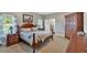 Cozy main bedroom with a decorative bed frame, neutral walls, and dark wood furniture at 17 Sassafras Ne Trl, Cartersville, GA 30121