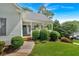 Charming covered front porch with a blue door and manicured bushes creates a welcoming entrance at 17 Sassafras Ne Trl, Cartersville, GA 30121