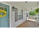 Cozy front porch has a porch swing and cheerful yellow accents at 17 Sassafras Ne Trl, Cartersville, GA 30121