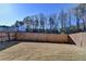 Large backyard with a wooden fence, providing privacy and space for outdoor activities at 2639 Cooper Brook Dr, Snellville, GA 30078