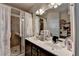 Bathroom featuring double sinks, shower, and a bright mirror providing ample space for grooming at 2639 Cooper Brook Dr, Snellville, GA 30078