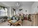 Bright bedroom with chandelier, neutral walls, large windows, and vaulted ceiling at 2639 Cooper Brook Dr, Snellville, GA 30078