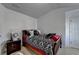 Bedroom features patterned bedding, complementary decor, and a ceiling fan at 2639 Cooper Brook Dr, Snellville, GA 30078
