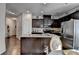 Kitchen featuring granite countertops, stainless steel appliances, and dark wood cabinets at 2639 Cooper Brook Dr, Snellville, GA 30078