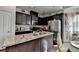 Kitchen featuring granite countertops, stainless steel appliances, and dark wood cabinets at 2639 Cooper Brook Dr, Snellville, GA 30078