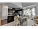 Open floor plan showcasing kitchen with granite countertops and adjacent formal sitting area at 2639 Cooper Brook Dr, Snellville, GA 30078