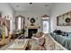 Formal living room with high ceilings, decorative fireplace, and elegant furnishings at 2639 Cooper Brook Dr, Snellville, GA 30078