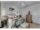 Comfortable main bedroom featuring a chandelier, bed, and two windows allowing plenty of natural light to filter in at 2639 Cooper Brook Dr, Snellville, GA 30078
