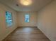 Bright, airy bedroom featuring two windows bringing natural light and neutral-toned walls at 3663 Heatherwood Ne Dr, Marietta, GA 30066