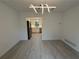 Open dining space with access to a modern kitchen with stainless steel refrigerator and white cabinetry at 3663 Heatherwood Ne Dr, Marietta, GA 30066