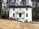 Charming two-story home with white siding, black door, and inviting front porch at 3663 Heatherwood Ne Dr, Marietta, GA 30066