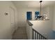 Upstairs hallway featuring contemporary lighting and access to multiple rooms at 3663 Heatherwood Ne Dr, Marietta, GA 30066