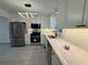 Bright kitchen with white cabinets, quartz countertops, stainless appliances, and stylish lighting at 3663 Heatherwood Ne Dr, Marietta, GA 30066