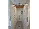 Compact laundry area with built-in shelving and white cabinetry at 3663 Heatherwood Ne Dr, Marietta, GA 30066
