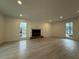 Bright living room with hardwood floors, brick fireplace, and recessed lighting at 3663 Heatherwood Ne Dr, Marietta, GA 30066