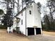 A well maintained two-car garage and white siding highlight this home's exterior at 3663 Heatherwood Ne Dr, Marietta, GA 30066
