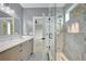 Beautiful bathroom features a glass enclosed shower, a floating vanity, and natural light at 462 Connally Se St, Atlanta, GA 30312