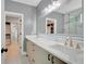 Elegant bathroom featuring double sinks, sleek vanity, and a glass-enclosed shower at 462 Connally Se St, Atlanta, GA 30312