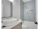Stylish bathroom featuring herringbone tile, soaking tub, and modern fixtures at 462 Connally Se St, Atlanta, GA 30312