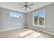 Light-filled bedroom with hardwood floors, large windows, and modern ceiling fan at 462 Connally Se St, Atlanta, GA 30312