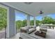 Spacious covered deck with ample seating, ceiling fans, and views of the lush backyard at 462 Connally Se St, Atlanta, GA 30312