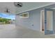 Relaxing outdoor deck area with black ceiling fans, blue siding, and a door to the inside at 462 Connally Se St, Atlanta, GA 30312