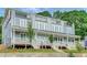 New construction townhomes feature modern design, balconies, and covered front porches at 462 Connally Se St, Atlanta, GA 30312