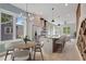 Bright, modern kitchen with stainless steel appliances, island with seating, and adjacent dining area at 462 Connally Se St, Atlanta, GA 30312