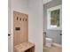 Charming mudroom entrance features a built-in bench and hanging hooks with hardwood flooring at 462 Connally Se St, Atlanta, GA 30312