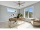 Bright home office with large windows, modern desk, ceiling fan, and comfortable seating at 462 Connally Se St, Atlanta, GA 30312