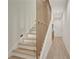 Elegant staircase with light wood steps and a modern, minimalist design at 462 Connally Se St, Atlanta, GA 30312
