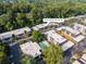 Aerial view of a neighborhood with lush trees and a community pool at 5170 Chemin De Vie NE at 5170 Chemin De Vie Ne, Sandy Springs, GA 30342
