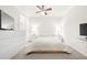 A minimalist bedroom featuring white walls, neutral accents and great natural light at 5170 Chemin De Vie Ne, Sandy Springs, GA 30342