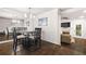 The dining area features hardwood flooring and is open to the comfortable living room at 5170 Chemin De Vie Ne, Sandy Springs, GA 30342