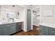Well-appointed kitchen featuring stainless appliances, white countertops, and lovely hardwood floors at 5170 Chemin De Vie Ne, Sandy Springs, GA 30342