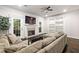 Inviting living room with a fireplace, built-in shelving, and access to the outdoors through glass doors at 5170 Chemin De Vie Ne, Sandy Springs, GA 30342