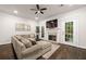 Comfortable living area with a cozy fireplace and convenient access to the outdoors through French doors at 5170 Chemin De Vie Ne, Sandy Springs, GA 30342