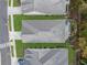 An aerial view showcases the manicured lawns, modern rooflines, and landscaped backyard of the neighborhood home at 218 Floral Valley Dr, Woodstock, GA 30188