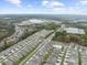 An aerial view shows the neighborhood's orderly layout, green spaces, and proximity to commercial areas, schools and highways at 218 Floral Valley Dr, Woodstock, GA 30188
