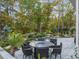 Serene backyard showcasing a natural waterfall feature complementing the patio and outdoor living space at 218 Floral Valley Dr, Woodstock, GA 30188