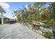Well-designed outdoor area with a stone patio, outdoor seating, and a scenic waterfall feature creates a serene setting at 218 Floral Valley Dr, Woodstock, GA 30188