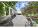 Paver patio leading to landscaped yard and outdoor dining area, great for outdoor gatherings and entertainment at 218 Floral Valley Dr, Woodstock, GA 30188