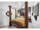 This is a cozy bedroom with a canopy bed and unique decor, creating a warm and inviting atmosphere at 218 Floral Valley Dr, Woodstock, GA 30188