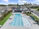 A resort style pool with lounge chairs and sunning shelves offers a refreshing escape and a touch of luxury at 218 Floral Valley Dr, Woodstock, GA 30188