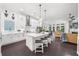 Open-concept kitchen with white cabinetry, a large island, and modern appliances at 218 Floral Valley Dr, Woodstock, GA 30188